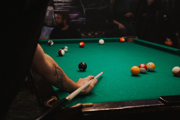 Person playing pool by himself