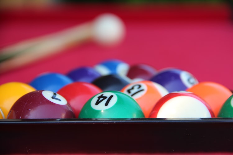 Clean billiard balls inside a rack