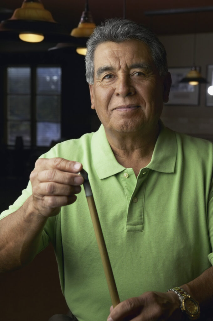 Man using a cue tip shaper