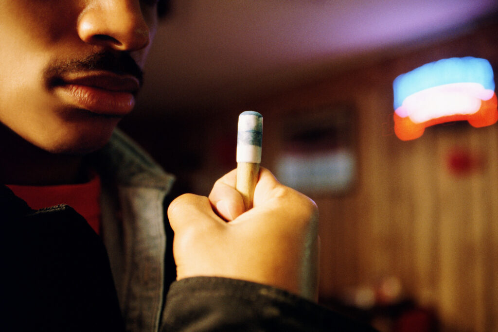 Man holding a pool cue