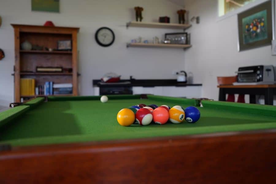Pool table set in a room