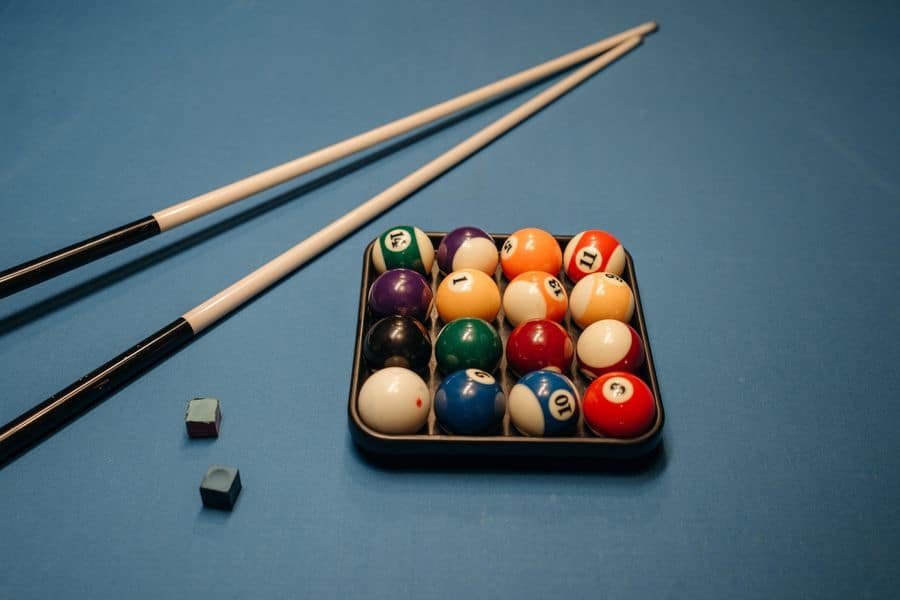 Pool cue sticks with ball set and chalk