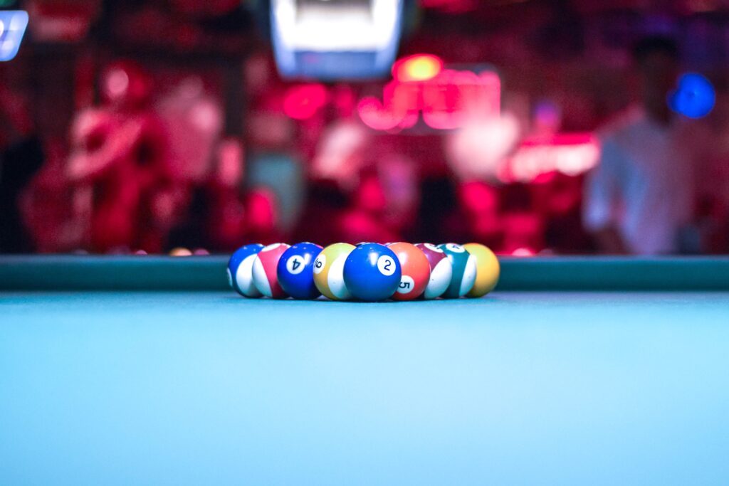 A pool rack with blue table felt cloth