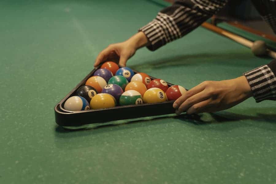 A guy preparing the billiard balls