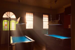 Two pool tables in light