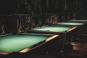 Pool tables horizontally aligned for play